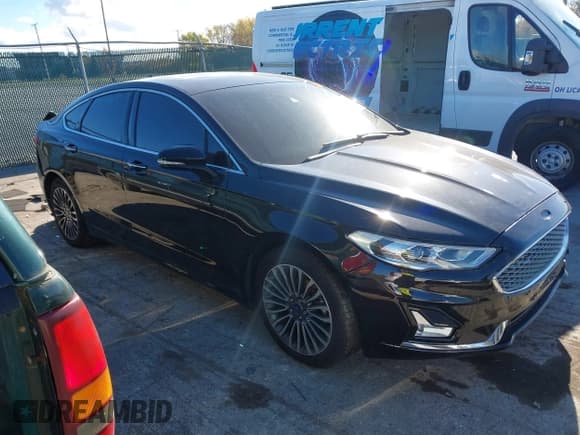 ✅ 2020 Ford Fusion Titanium • VIN: 3FA6P0D98LR174391 • Lot: 43470790. Listed on IAAI with 74,718 mi. Free auction sales archive from the USA and detailed vehicle history report at DreamBid. Image 13.
