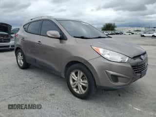 2011 Hyundai Tucson Limited z VIN KM8JUCAC0BU224654, wystawiony jako Copart lot #83989635 z przebiegiem 168 610 mil mil oraz Szkoda całkowita • Salvage title. Historia ofert i sprzedaży dostępna na DreamBid. Obrazek 4.