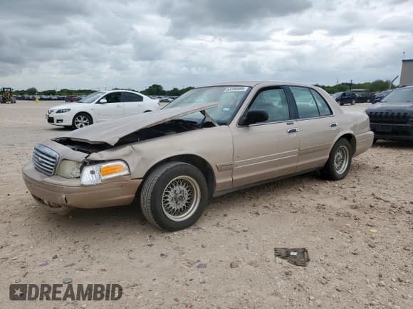 ✅ 1998 Ford Crown Victoria LX • VIN: 2FAFP74W1WX119043 • Lot: 63398405. Listed on Copart with 79,743 mi. Free auction sales archive from the USA and detailed vehicle history report at DreamBid. Image 1.