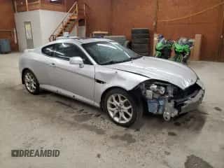 2007 Hyundai Tiburon GT z VIN KMHHN66F47U251850, wystawiony jako Copart lot #51900565 z przebiegiem 130 388 mil mil oraz Szkoda całkowita • Salvage title. Historia ofert i sprzedaży dostępna na DreamBid. Obrazek 4.