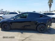 ✅ 2023 Tesla Model Y Long Range • VIN: 7SAYGDEE0PA023719 • Lot: 41974415. Listed on IAAI with 50,152 mi. Free auction sales archive from the USA and detailed vehicle history report at DreamBid. Image 15.