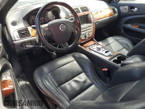 ✅ 2011 Jaguar XK XKR • VIN: SAJWA4DC3BMB42457 • Lot: 61157735. Listed on Copart with 128,452 mi. Free auction sales archive from the USA and detailed vehicle history report at DreamBid. Image 8.