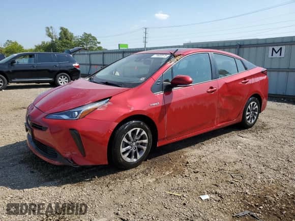 2021 Toyota Prius L Eco with VIN JTDKAMFU9M3134940, listed as a Copart auction lot 71632875 with 34,382 mi miles and Salvage title. Bid and sale history available at DreamBid. Image 1.