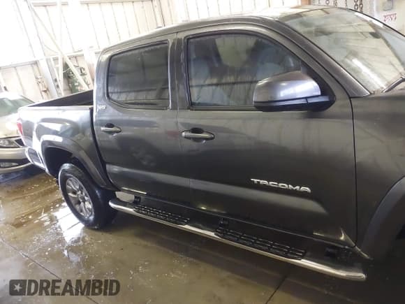 ✅ 2018 Toyota Tacoma SR5 • VIN: 3TMAZ5CNXJM074748 • Lot: 43714836. Listed on IAAI with 156,426 mi. Free auction sales archive from the USA and detailed vehicle history report at DreamBid. Image 12.