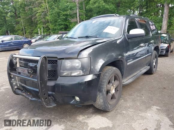 2011 Chevrolet Tahoe LTZ with VIN 1GNSKCE05BR169305, listed as a IAAI auction lot 42247417 with 214,713 mi miles and . Bid and sale history available at DreamBid. Image 2.