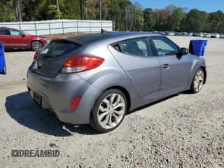 2013 Hyundai Veloster w/Black Int z VIN KMHTC6AD2DU144524, wystawiony jako Copart lot #86604965 z przebiegiem 101 979 mil mil oraz Czysty tytuł • Clean title. Historia ofert i sprzedaży dostępna na DreamBid. Obrazek 3.
