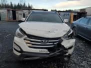 ✅ 2014 Hyundai Santa Fe • VIN: 5XYZUDLB8EG159107 • Lot: 89474465. Listed on Copart with 135,472 mi. Free auction sales archive from the USA and detailed vehicle history report at DreamBid. Image 5.