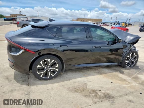 ✅ 2022 Kia EV6 GT-Line • VIN: KNDC44LA9N5052962 • Лот: 60885465. Опубликован ранее на Copart с пробегом 27 532 миль. Бесплатный доступ к архиву аукционных продаж из США и подробный отчёт об истории автомобиля на DreamBid. Изображение 3.