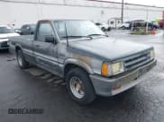 ✅ 1987 Mazda B-Series • VIN: JM2UF2111H0546977 • Lot: 41931286. Wystawiony na IAAI z przebiegiem 167 443 mil. Bezpłatny archiwum sprzedaży aukcyjnych z USA i szczegółowy raport historii pojazdu na DreamBid. Zdjęcie 1.