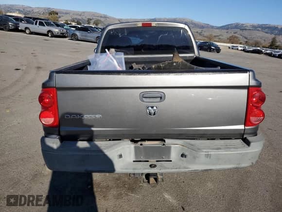 2006 Dodge Dakota ST z VIN 1D7HE28K26S626657, wystawiony jako Copart lot #88314565 z przebiegiem 186 690 mil mil oraz Szkoda całkowita • Salvage title. Historia ofert i sprzedaży dostępna na DreamBid. Obrazek 6.