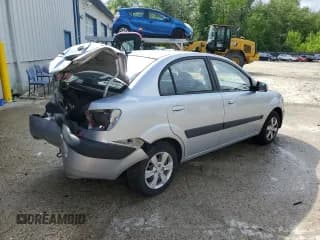 ✅ 2009 Kia Rio LX • VIN: KNADE223396548989 • Lot: 64964304. Listed on Copart with 150,426 mi. Free auction sales archive from the USA and detailed vehicle history report at DreamBid. Image 3.