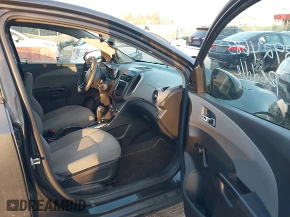 ✅ 2014 Chevrolet Sonic LS • VIN: 1G1JA6SG5E4158552 • Lot: 43924683. Listed on IAAI with 99,432 mi. Free auction sales archive from the USA and detailed vehicle history report at DreamBid. Image 5.