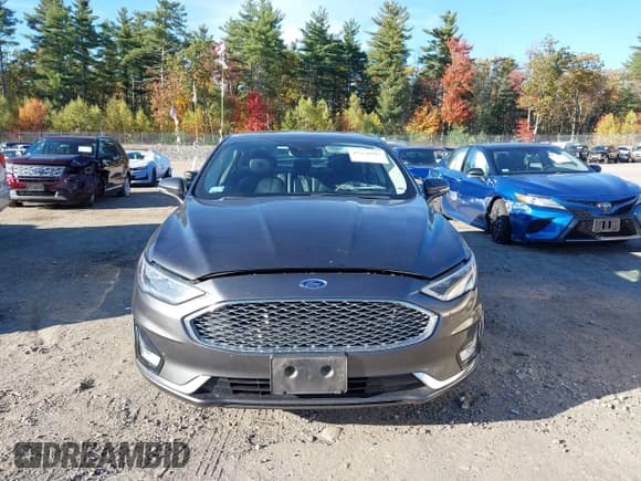 ✅ 2019 Ford Fusion Titanium • VIN: 3FA6P0RUXKR106542 • Lot: 43450593. Listed on IAAI with 141,675 mi. Free auction sales archive from the USA and detailed vehicle history report at DreamBid. Image 13.