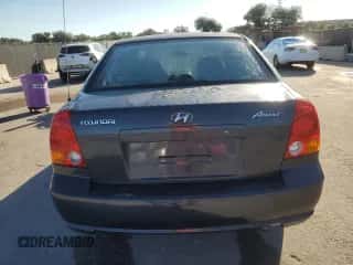 2005 Hyundai Accent GLS z VIN KMHCG45C05U665091, wystawiony jako Copart lot #87264075 z przebiegiem 179 141 mil mil oraz Szkoda całkowita • Salvage title. Historia ofert i sprzedaży dostępna na DreamBid. Obrazek 6.