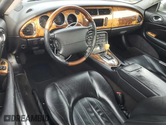 ✅ 2004 Jaguar XK • VIN: SAJDA42C442A37967 • Lot: 45768895. Listed on Copart with 124,130 mi. Free auction sales archive from the USA and detailed vehicle history report at DreamBid. Image 8.