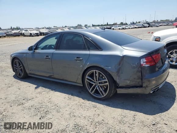 ✅ 2013 Audi S8 • VIN: WAUD2AFD7DN027777 • Лот: 62482694. Опубликован ранее на Copart с пробегом 128 383 миль. Бесплатный доступ к архиву аукционных продаж из США и подробный отчёт об истории автомобиля на DreamBid. Изображение 2.