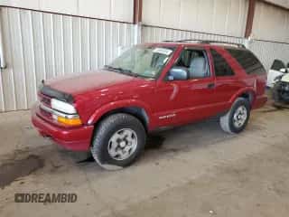 2003 Chevrolet Blazer LS z VIN 1GNCT18X13K165163, wystawiony jako Copart lot #78693034 z przebiegiem 159 770 mil mil oraz Szkoda całkowita • Salvage title. Historia ofert i sprzedaży dostępna na DreamBid. Obrazek 1.