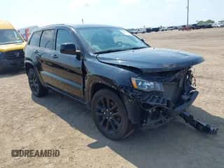 2021 Jeep Grand Cherokee Laredo E with VIN 1C4RJEAG8MC596881, listed as a IAAI auction lot 43050572 with 70,902 mi miles and . Bid and sale history available at DreamBid. Image 1.