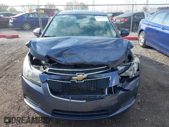 2013 Chevrolet Cruze 1LT z VIN 1G1PC5SB1D7232128, wystawiony jako IAAI lot #40415492 z przebiegiem 159 418 mil mil oraz . Historia ofert i sprzedaży dostępna na DreamBid. Obrazek 12.