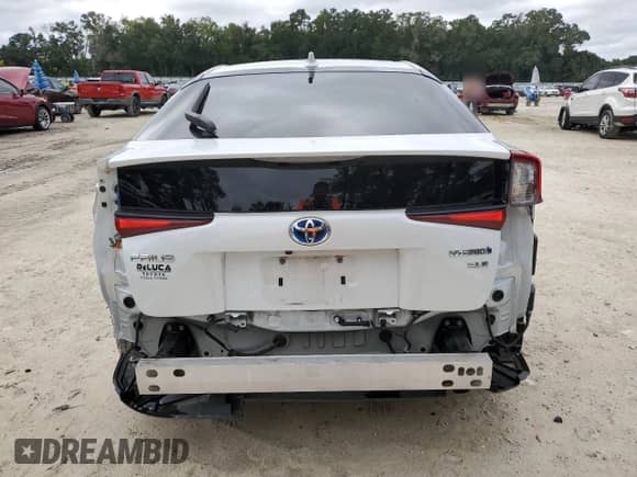 2021 Toyota Prius L Eco with VIN JTDKAMFU4M3139334, listed as a Copart auction lot 84025305 with 59,418 mi miles and Salvage title. Bid and sale history available at DreamBid. Image 6.