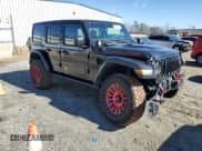 ✅ 2023 Jeep Wrangler Rubicon • VIN: 1C4HJXFN3PW618061 • Lot: 85577684. Listed on Copart with 25,880 mi. Free auction sales archive from the USA and detailed vehicle history report at DreamBid. Image 4.
