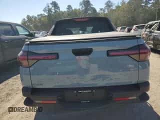 2024 Hyundai Santa Cruz SEL z VIN 5NTJBDDE8RH104510, wystawiony jako Copart lot #77585554 z przebiegiem 10 848 mil mil oraz Szkoda całkowita • Salvage title. Historia ofert i sprzedaży dostępna na DreamBid. Obrazek 6.