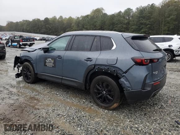 ✅ 2023 Mazda CX-50 S Preferred Plus • VIN: 7MMVABCM9PN112757 • Lot: 90320495. Listed on Copart with 57,072 mi. Free auction sales archive from the USA and detailed vehicle history report at DreamBid. Image 2.