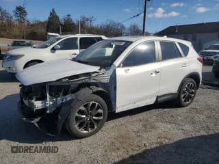 ✅ 2016 Mazda CX-5 Grand Touring • VIN: JM3KE4DY2G0691969 • Lot: 92262885. Wystawiony na Copart z przebiegiem 65 146 mil. Bezpłatny archiwum sprzedaży aukcyjnych z USA i szczegółowy raport historii pojazdu na DreamBid. Zdjęcie 1.