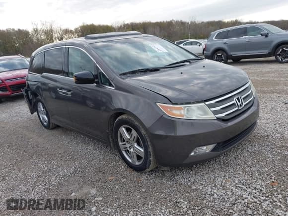 ✅ 2012 Honda Odyssey Touring • VIN: 5FNRL5H92CB083290 • Lot: 43664749. Listed on IAAI with 315,361 mi. Free auction sales archive from the USA and detailed vehicle history report at DreamBid. Image 1.