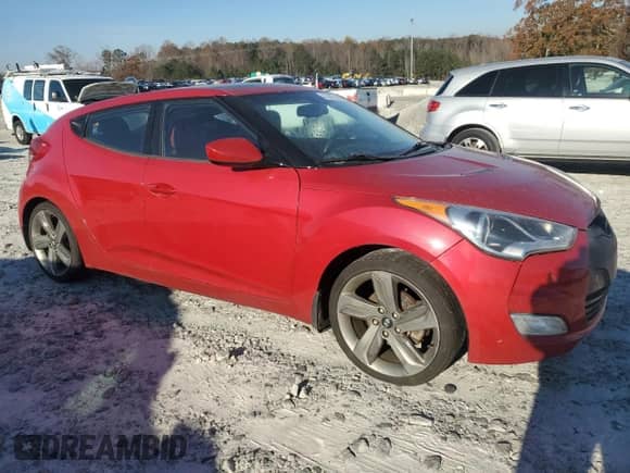 2012 Hyundai Veloster w/Red Int z VIN KMHTC6AD9CU084434, wystawiony jako Copart lot #83387244 z przebiegiem 177 841 mil mil oraz Czysty tytuł • Clean title. Historia ofert i sprzedaży dostępna na DreamBid. Obrazek 4.