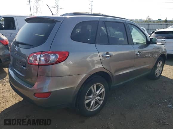 2012 Hyundai Santa Fe Limited with VIN 5XYZKDAG5CG110772, listed as a Copart auction lot 71411764 with 218,606 mi miles and Salvage title. Bid and sale history available at DreamBid. Image 3.