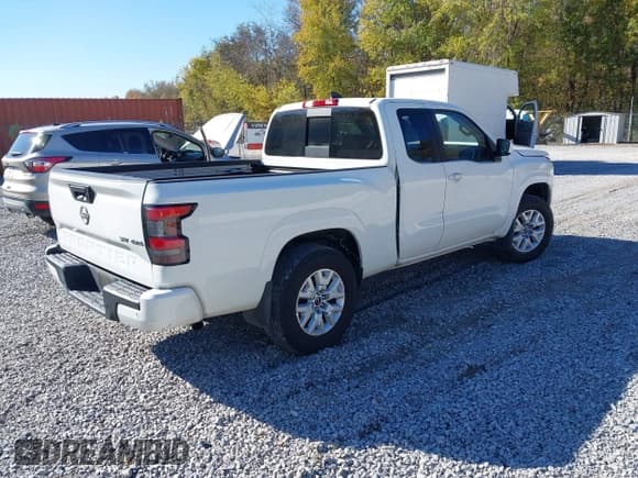 ✅ 2023 Nissan Frontier S • VIN: 1N6ED1CM5PN634140 • Lot: 43645990. Listed on IAAI with 31,135 mi. Free auction sales archive from the USA and detailed vehicle history report at DreamBid. Image 4.