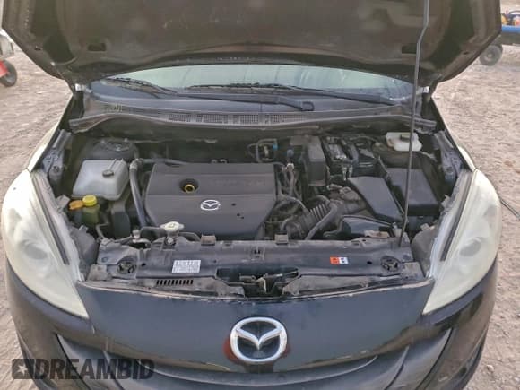 ✅ 2015 Mazda 5 Sport • VIN: JM1CW2BL2F0184543 • Lot: 96850655. Listed on Copart with 119,744 mi. Free auction sales archive from the USA and detailed vehicle history report at DreamBid. Image 12.