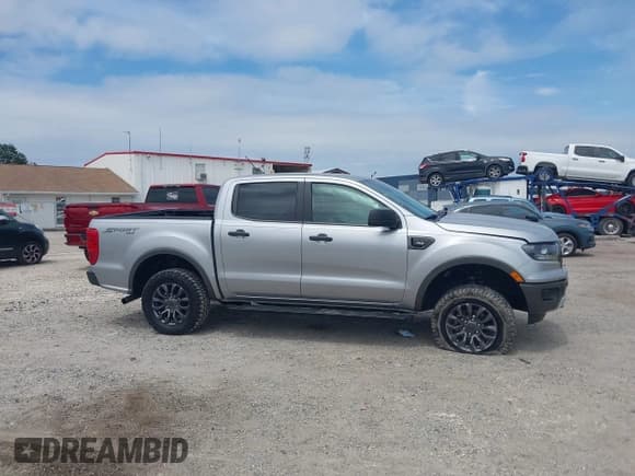 ✅ 2020 Ford Ranger Lariat • VIN: 1FTER4FH9LLA71409 • Lot: 43205180. Listed on IAAI with 41,813 mi. Free auction sales archive from the USA and detailed vehicle history report at DreamBid. Image 13.