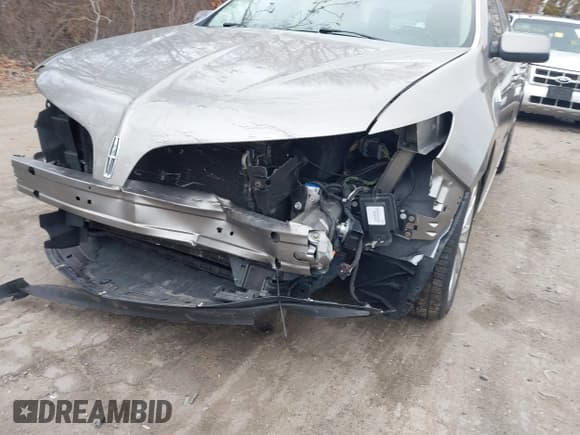 ✅ 2015 Lincoln MKS EcoBoost • VIN: 1LNHL9FT9FG603959 • Lot: 41733606. Listed on IAAI with 69,743 mi. Free auction sales archive from the USA and detailed vehicle history report at DreamBid. Image 6.