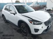 ✅ 2016 Mazda CX-5 Grand Touring • VIN: JM3KE2DY3G0863303 • Lot: 43848862. Wystawiony na IAAI z przebiegiem 95 498 mil. Bezpłatny archiwum sprzedaży aukcyjnych z USA i szczegółowy raport historii pojazdu na DreamBid. Zdjęcie 1.