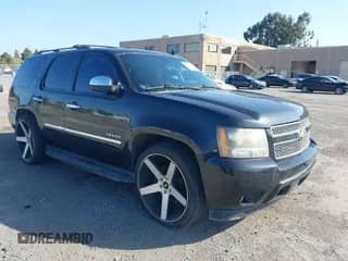 2011 Chevrolet Tahoe LTZ with VIN 1GNSCCE06BR171125, listed as a IAAI auction lot 42106289 with 152,613 mi miles and . Bid and sale history available at DreamBid. Image 1.