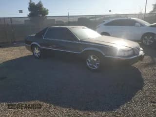 ✅ 2001 Cadillac Eldorado ESC • VIN: 1G6EL12Y21B105623 • Лот: 80270274. Опубликован ранее на Copart с пробегом 100 143 миль. Бесплатный доступ к архиву аукционных продаж из США и подробный отчёт об истории автомобиля на DreamBid. Изображение 4.