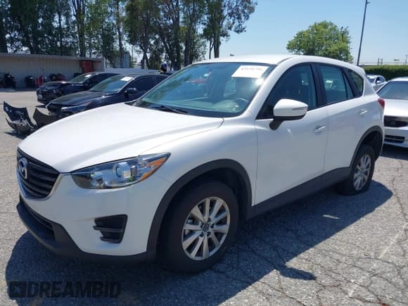 ✅ 2016 Mazda CX-5 Sport • VIN: JM3KE2BY5G0793032 • Lot: 42128706. Listed on IAAI with 52,010 mi. Free auction sales archive from the USA and detailed vehicle history report at DreamBid. Image 17.