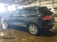 ✅ 2013 Volkswagen Touareg Lux • VIN: WVGEF9BP7DD007945 • Lot: 65758255. Listed on Copart with 90,086 mi. Free auction sales archive from the USA and detailed vehicle history report at DreamBid. Image 2.