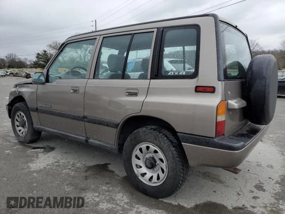 ✅ 1997 Suzuki Sidekick JX • VIN: 2S3TD03V4V6403519 • Lot: 49666085. Listed on Copart with 54,577 mi. Free auction sales archive from the USA and detailed vehicle history report at DreamBid. Image 2.