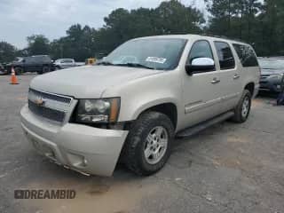 2007 Chevrolet Suburban LT z VIN 1GNFC16027J289845, wystawiony jako Copart lot #81099795 z przebiegiem 137 667 mil mil oraz Szkoda całkowita • Salvage title. Historia ofert i sprzedaży dostępna na DreamBid. Obrazek 1.
