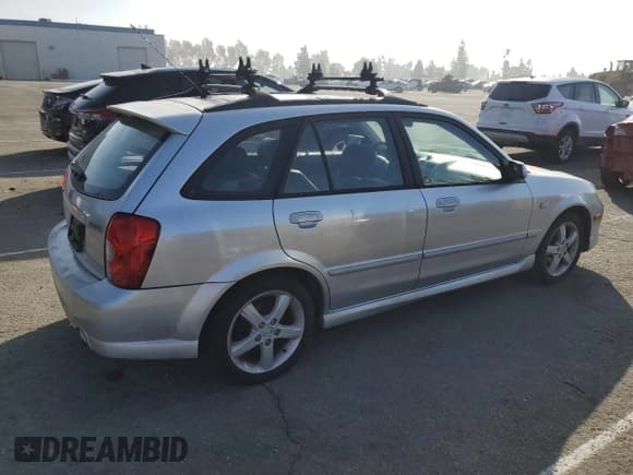 ✅ 2003 Mazda Protege • VIN: JM1BJ246331220991 • Лот: 86839925. Опубликован ранее на Copart с пробегом 118 760 миль. Бесплатный доступ к архиву аукционных продаж из США и подробный отчёт об истории автомобиля на DreamBid. Изображение 3.