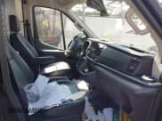 ✅ 2021 Ford Transit Cargo • VIN: 1FTBR3XG8MKA89703 • Lot: 42885214. Listed on IAAI with 79,907 mi. Free auction sales archive from the USA and detailed vehicle history report at DreamBid. Image 5.