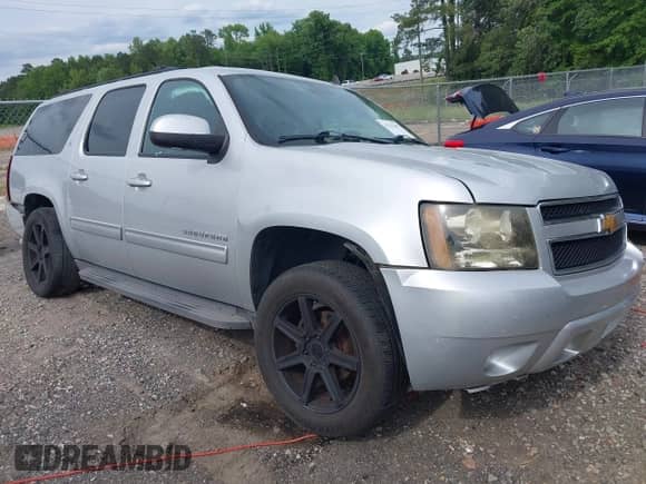2014 Chevrolet Suburban LT z VIN 1GNSCJE0XER203597, wystawiony jako IAAI lot #42215407 z przebiegiem 186 556 mil mil oraz . Historia ofert i sprzedaży dostępna na DreamBid. Obrazek 1.