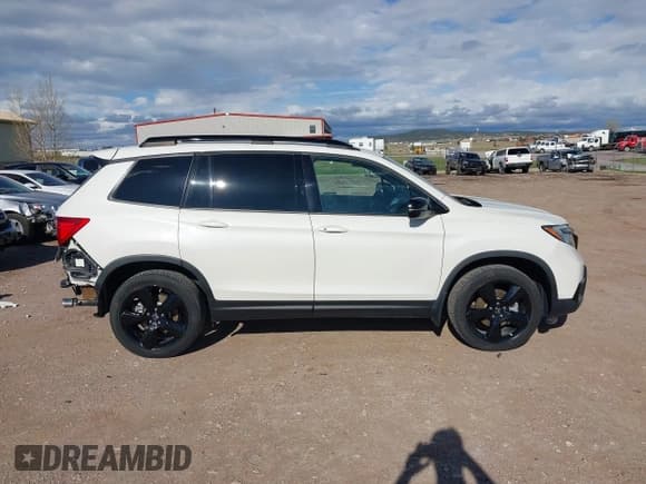 ✅ 2019 Honda Passport Elite • VIN: 5FNYF8H0XKB001472 • Лот: 42143890. Опубликован ранее на IAAI с пробегом 98 119 миль. Бесплатный доступ к архиву аукционных продаж из США и подробный отчёт об истории автомобиля на DreamBid. Изображение 14.