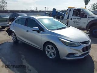 ✅ 2018 Chevrolet Cruze Premier • VIN: 3G1BF6SM0JS550814 • Lot: 43506072. Listed on IAAI with 75,963 mi. Free auction sales archive from the USA and detailed vehicle history report at DreamBid. Image 1.