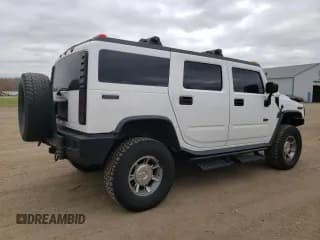✅ 2003 Hummer H2 • VIN: 5GRGN23U33H117201 • Лот: 78998864. Опубликован ранее на Copart с пробегом 279 930 миль. Бесплатный доступ к архиву аукционных продаж из США и подробный отчёт об истории автомобиля на DreamBid. Изображение 3.