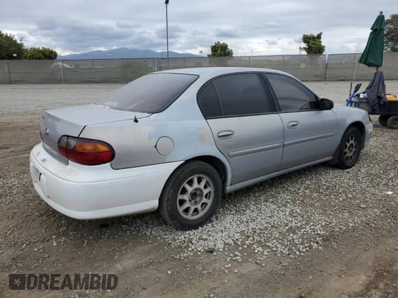 1998 Chevrolet Malibu LS z VIN 1G1NE52M6WY121140, wystawiony jako Copart lot #45587894 z przebiegiem 278 488 mil mil oraz Czysty tytuł • Clean title. Historia ofert i sprzedaży dostępna na DreamBid. Obrazek 3.
