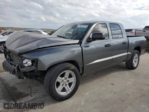 2008 Dodge Dakota SLT with VIN 1D7HE48N58S578824, listed as a Copart auction lot 78477474 with 64,557 mi miles and Salvage title. Bid and sale history available at DreamBid. Image 1.